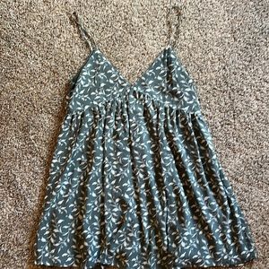 Short, V-neck, spaghetti strap sundress. green with leaves adjustable straps.